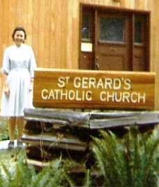 The "St. Gerard's Catholic Church" Bowen church sign carved by Harry Wright, soon after it was installed in 1971. Sister Jo Wright beside the sign. Peter Wright photo.