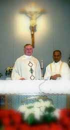 Fathers Comey and George at Christmas at Holy Trinity. Photo courtesy of Holy Trinity Parish.