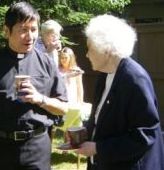 Sister Marian MacDonald with Father Rey at the 4th anniversary celebration on the St. Gerard's lawn.